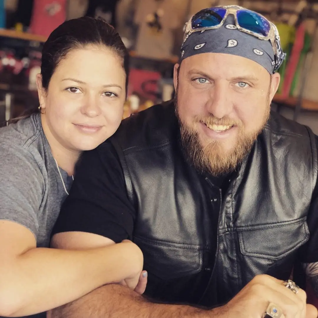 A man and woman posing for the camera.